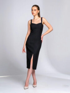 A woman wearing a black sheath dress