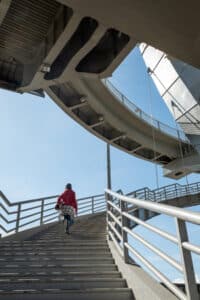 A woman running up the staircase