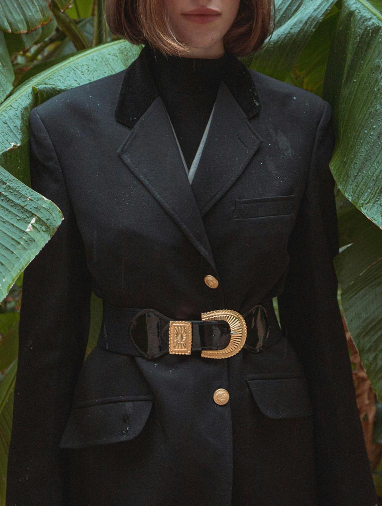 Cropped woman wearing a well-fitted black blazer
