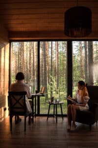 A couple enjoying each other's company while engaging in their own activities.