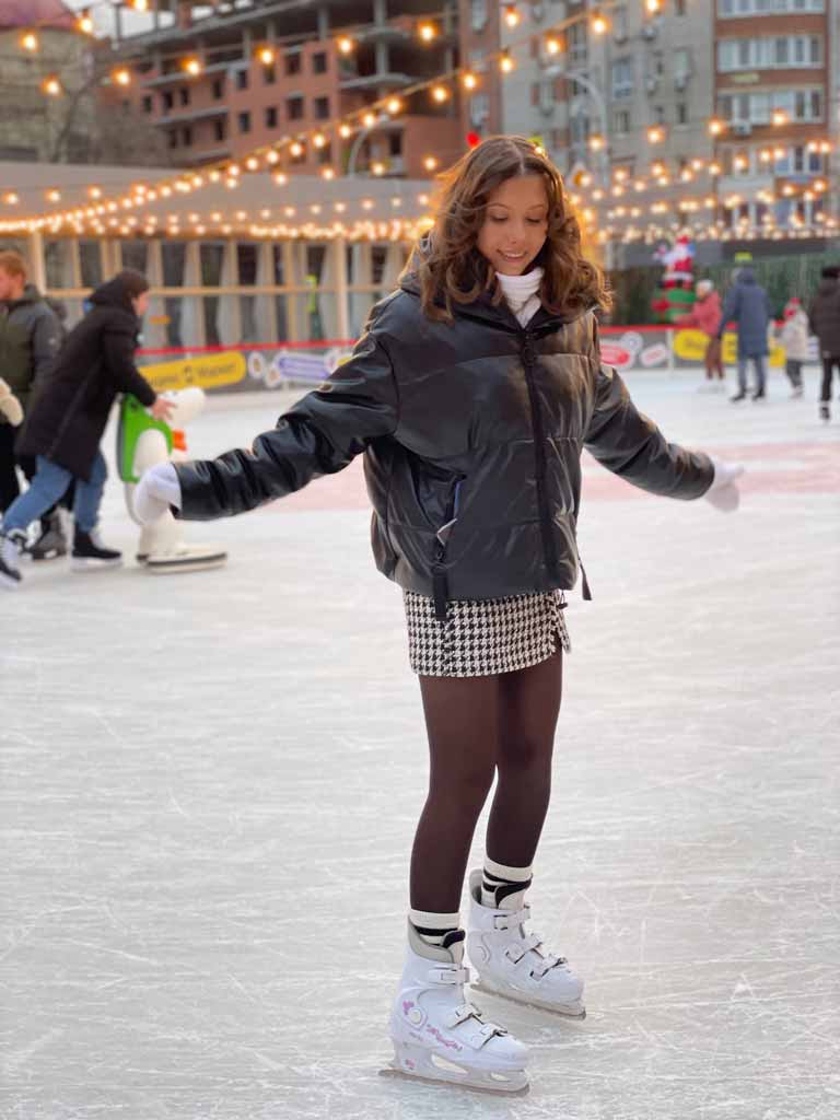 A woman skating in an ice rink