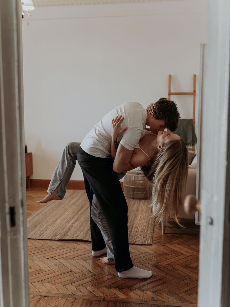 Couple dancing and having fun in their living room