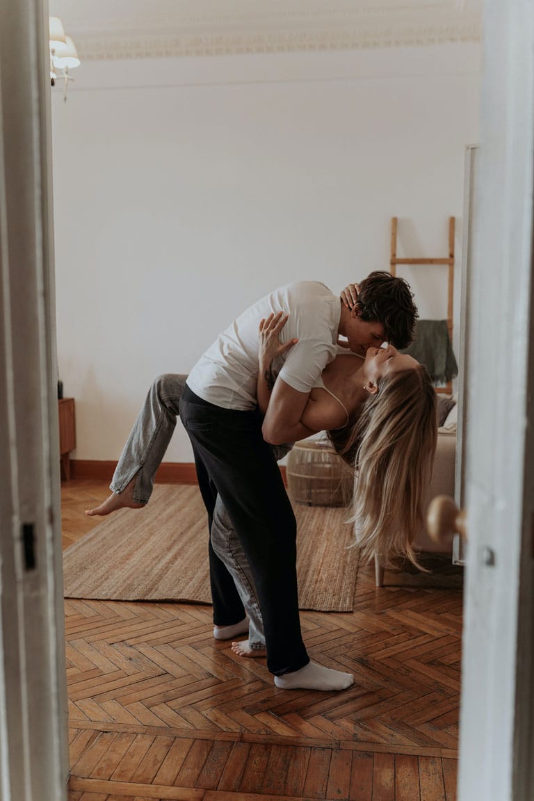 Couple dancing and having fun in their living room